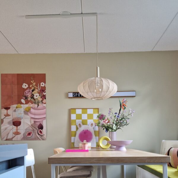 Lightswing® Single Matt White with one pendant light above dining table in colorful modern interior