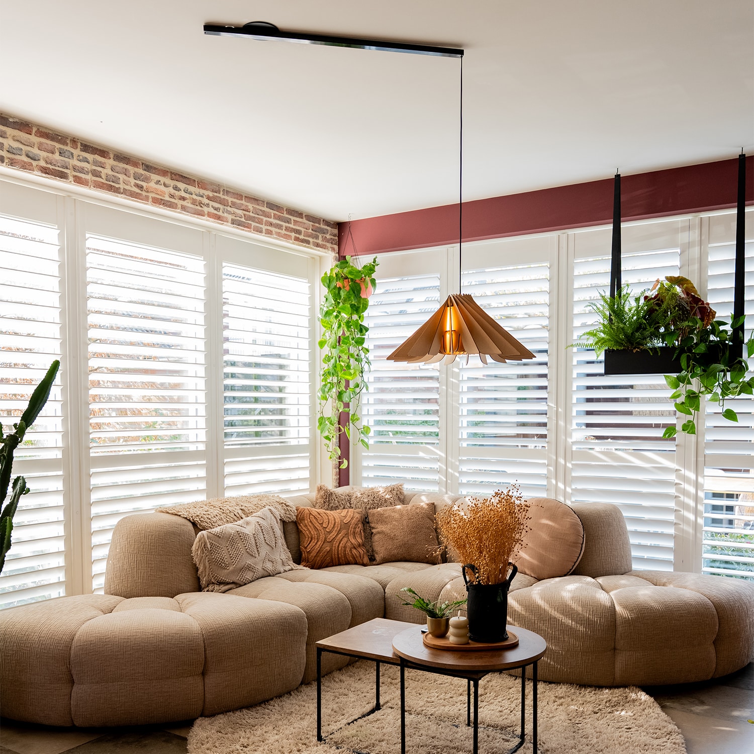 Lightswing® Single Matt Black with Pendant Light Novo Naturel above coffee table in modern living room