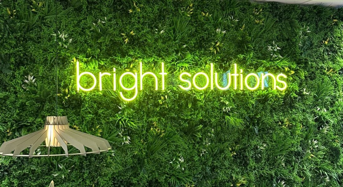 Bright-Solutions-Office Lightswing® Twin Stainless Steel with pendant light in office space with Bright Solutions logo